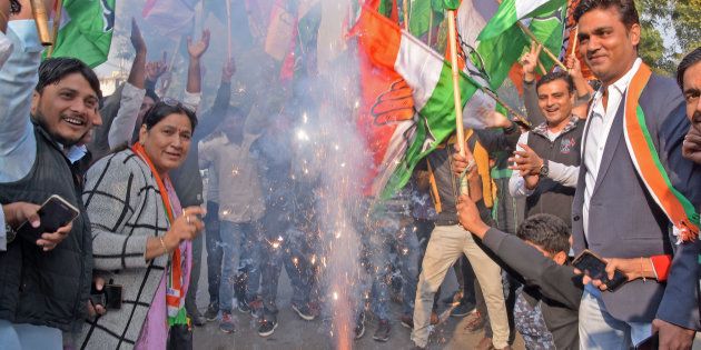 Congress workers and supporters celebrate after the party's victory in Rajasthan.