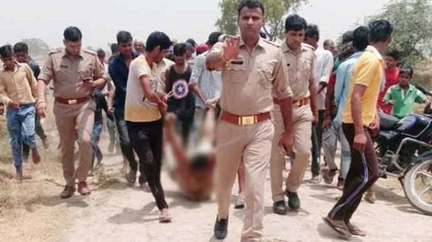 Qasim's body being dragged after he was beaten on the rumor of cow slaughter.