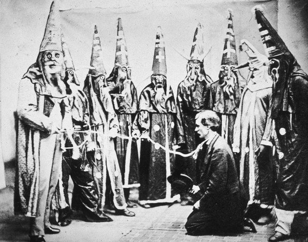Illustration of a group of hooded Ku Klux Klan members preparing to lynch president Abraham Lincoln, circa 1867.
