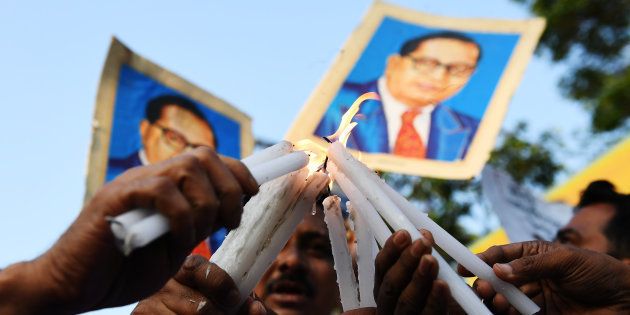 REPRESENTATIONAL IMAGE. Indian activists hold candles and portraits of 20th century Indian social reformer B. R. Ambedkar as they take part in a protest against a Supreme Court order that allegedly diluted the Scheduled Castes and Scheduled Tribes (Prevention of Atrocities) Act in Kolkata on April 4, 2018.
