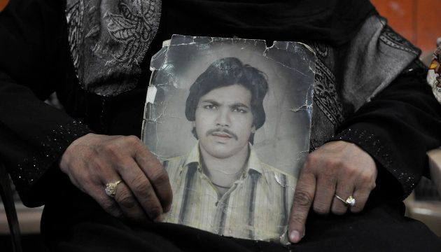 Zehbunisha shows picture of her husband wife of Mohd Iqbal who was killed in 1987 Hashimpura massacre during a press conference in March, 2015, in New Delhi.