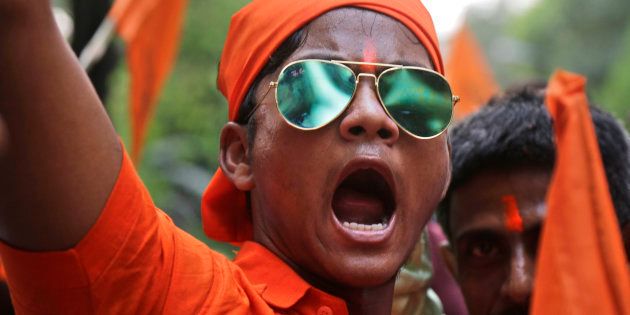 An activist of India's ruling Bharatiya Janata Party (BJP) shouts slogans as he participates in a religious procession of Hindu festival of Ram Navami in Kolkata, India, Sunday, March 25, 2018.