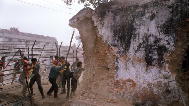 Karsevaks attack the wall of the Babri Masjid on December 6, 1992.