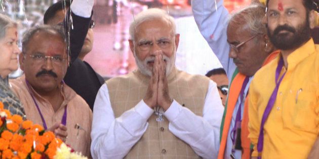 Prime Minister Narendra Modi welcomed by party workers during his public meeting on 26 November in Kota.