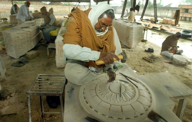 Artisans carve stone blocks for the proposed Ram temple in Ayodhya in January 2004.