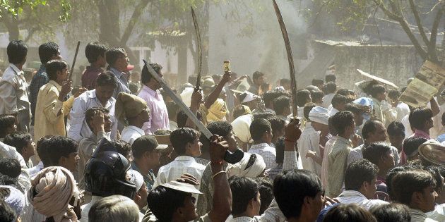 A 2002 photo of a Hindu mob waving swords during communal riots in Ahmedabad.
