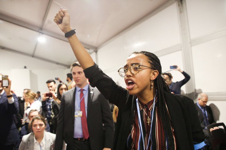 Demonstrators at the COP24 climate conference on Dec. 10 in Katowice, Poland, respond to Donald Trump's advisor Wells Griffith saying the U.S. will not reject coal mining or fossil fuel use.