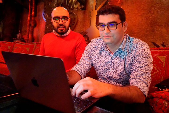 Certfa researchers Nariman Gharib, left, and Amin Sabeti, shown at a cafe in London on Dec. 7, 2018. Certfa helped uncover the Charming Kitten campaign. 
