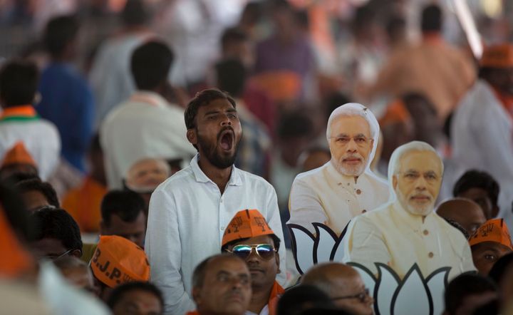 A Bharatiya Janata Party supporter yawns during an election campaign rally addressed by Prime Minister Narendra Modi at Mahabubnagar district of Telangana in November, 2018. 