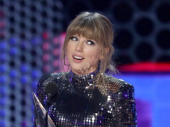 Taylor Swift accepts an award at the American Music Awards. 