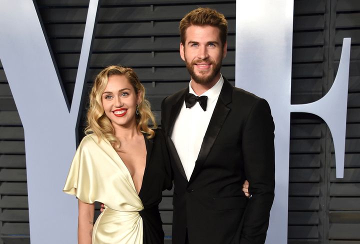 Miley Cyrus and Liam Hemsworth arrive at the Vanity Fair Oscar Party on March 4. 