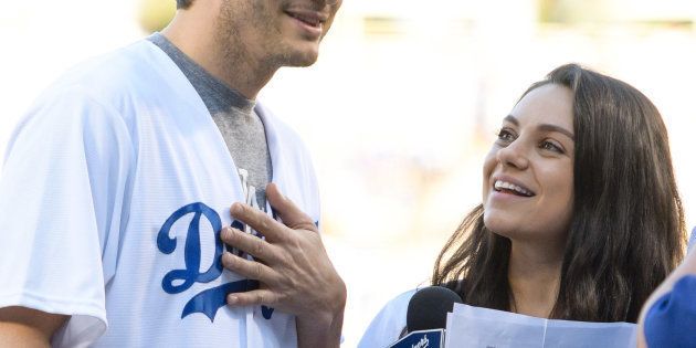 LOS ANGELES, CA - OCTOBER 19: Ashton Kutcher (L) and Mila Kunis attend game 4 of the NLCS between the Chicago Cubs and the Los Angeles Dodgers at Dodger Stadium on October 19, 2016 in Los Angeles, California. (Photo by Noel Vasquez/GC Images)