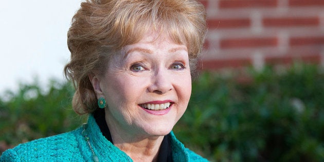 WEST HOLLYWOOD, CA - SEPTEMBER 29: Debbie Reynolds arrives for the signing of her book, 'Unsinkable,' on September 29, 2013 in West Hollywood, California. (Photo by Gabriel Olsen/FilmMagic)