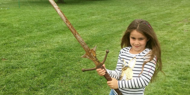 Matilda Jones, from Norton, Doncaster, shows off a mighty sword that she found at the bottom of a lake where King Arthur's said to have returned his Excalibur.