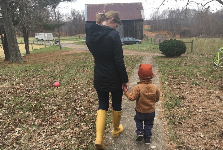 Jamie Tiralla, 36, walks with her 3-year-old son, Isaac, on the family’s farm in Prince Frederick, Maryland. Tiralla and her