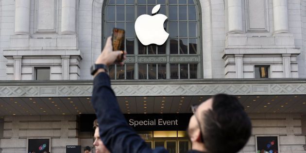 An attendee takes a photograph with a mobile device outside of the Bill Graham Civic Auditorium before the start an Apple Inc. event in San Francisco, California, U.S., on Wednesday, Sept. 7, 2016. Apple Inc. Gadget enthusiasts will be watching with great interest as Apple Inc. is expected to unveil both a new watch and iPhone 7, as well as improvements to the iOS 10 operating system. Photographer: Michael Short/Bloomberg via Getty Images
