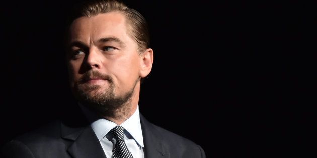 U.S. actor Leonardo DiCaprio looks on prior to speaking on stage during the Paris premiere of the documentary film
