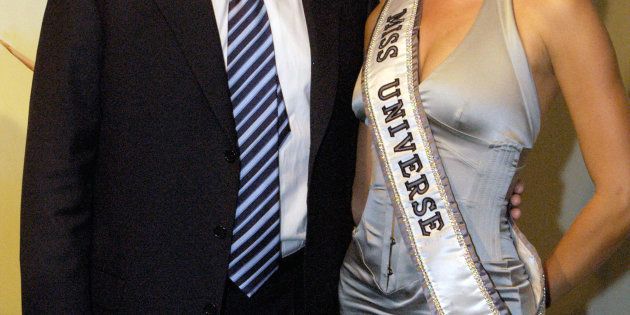 NEW YORK - JULY 28: Donald Trump and Miss Universe Jennifer Hawkins pose for photographers at a cocktail party celebrating her crowning on July 28, 2004 in New York City. The party, hosted by the Hon. Ken Allen, Consul General of Australia was held at the Australian Consulate (Photo by Brownie Medina/Getty Images).