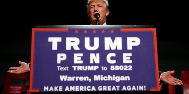 Republican presidential nominee Donald Trump appears at a campaign rally in Warren, Michigan U.S. October 31, 2016. REUTERS/Carlo Allegri