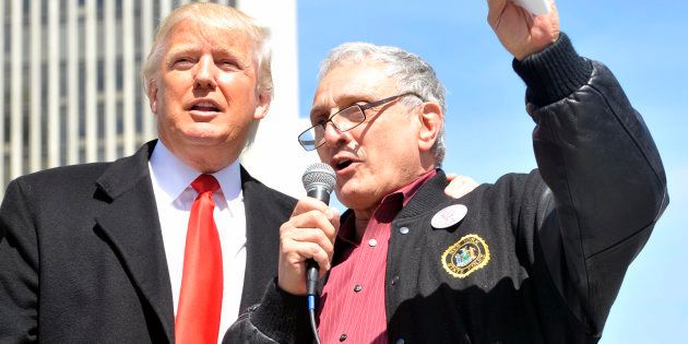 Businessmen Donald Trump (L) and Carl Paladino speak during a pro-gun rally at the Empire State Plaza in Albany, New York, April 1, 2014. REUTERS/Hans Pennink (UNITED STATES - Tags: POLITICS BUSINESS)