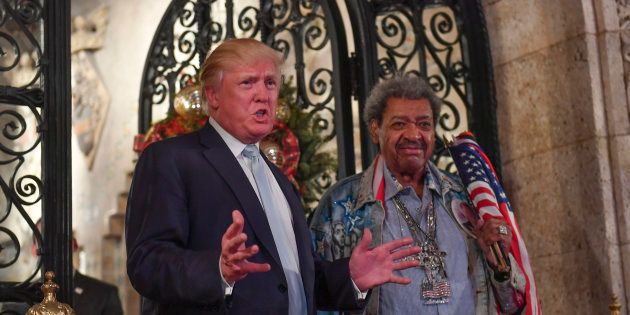 So many parties. Donald Trump stands with fight promoter Don King as they address the media during a party at Mar-a-Lago on Dec. 28.