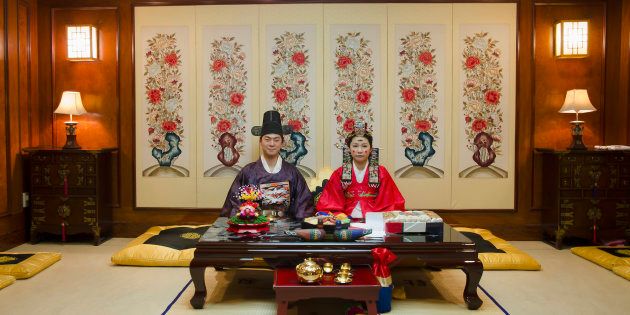 A couple poses in a traditional wedding hall in Anyang, South Korea.