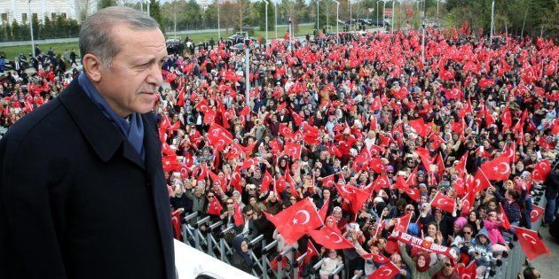 Erdogan greets the crowd, who were waiting to celebrate the results of the referendum, after he arrived in the Esenboga International Airport in Ankara, Turkey on April 17.