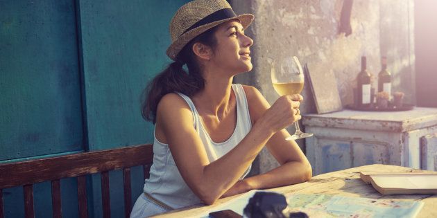Shot of a tourist having a glass of wine while taking a break from travelinghttp://195.154.178.81/DATA/i_collage/pu/shoots/805799.jpg