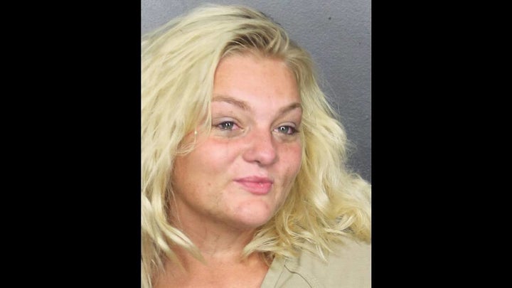 Teresa Gardner, 27, of Pompano Beach, Florida, is accused of stuffing a backpack with four Chihuahuas and slamming against ta