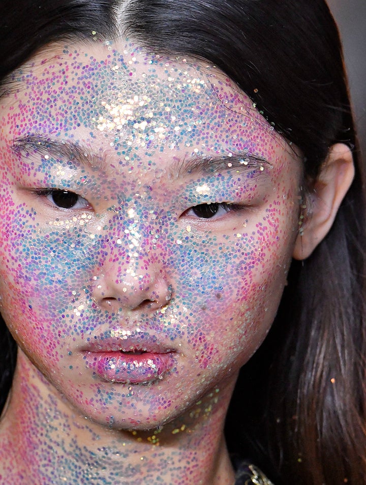 A model with a face covered in glitter at the Giambattista fall 2018 ready-to-wear show in Paris. If you don't want to look like a disco ball, this is probably a look you should avoid. 