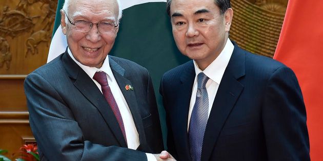 Pakistan Foreign Affairs Adviser Sartaj Aziz (L) shakes hands with Chinese Foreign Minister Wang Yi before a meeting at the Ministry of Foreign Affairs in Beijing on April 27, 2016. IORI SAGISAWA/AFP/Getty Images
