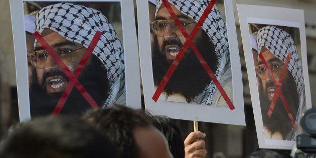 Activists carry placards showing Jaish-e-Mohammad Chief Masood Azhar during a protest against the attack on the air force base in Pathankot. Mumbai, January 4, 2016. INDRANIL MUKHERJEE/AFP/Getty Images