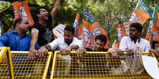 Delhi BJP supporters shout slogans against CPI(M) leadership to protest the attacks on RSS workers in Kerala.