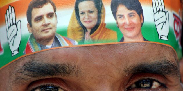 A Congress party worker wears a band on his forehead with pictures of party leaders Sonia Gandhi, Rahul Gandhi, and Priyanka Gandhi in Allahabad, India, Wednesday, April 11, 2007. (AP Photo/Rajesh Kumar Singh)