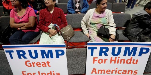 Signs placed on seats as people wait for a charity event hosted by the Republican Hindu Coalition.