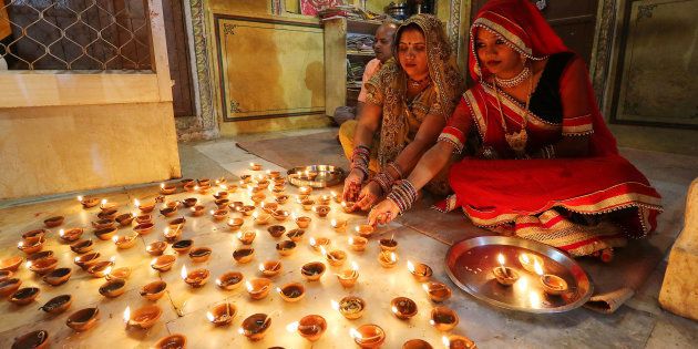 Women light earthen lamps diyas at Ramchandran Ji Temple on the occasion of Diwali in Jaipur, October 30, 2016. (Photo By Vishal Bhatnagar/NurPhoto via Getty Images) (Photo by Vishal Bhatnagar/NurPhoto via Getty Images)
