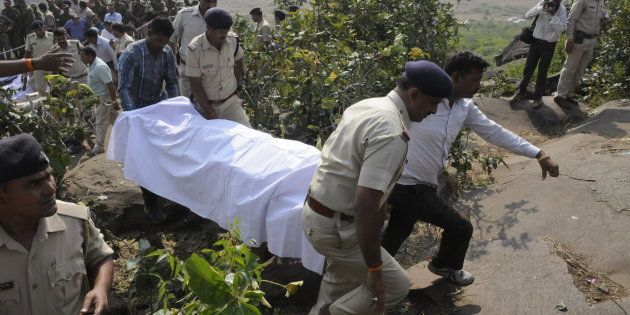 Police personnel carrying the body of SIMI terrorists killed in an encounter at Acharpura on October 31, 2016 in Bhopal, India.