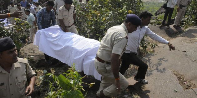 Police personnel carrying the body of SIMI terrorists killed in an encounter at Acharpura on October 31, 2016 in Bhopal, India.