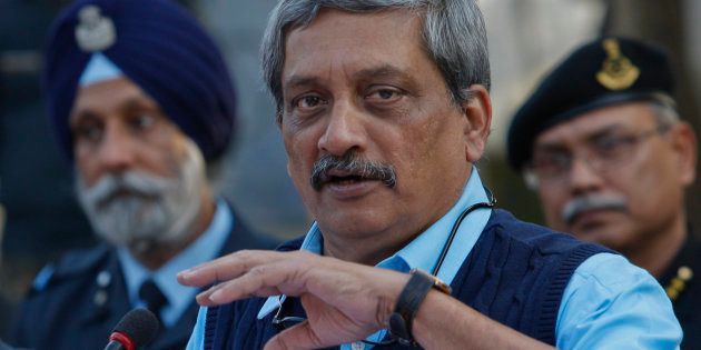 Indian Defense Minister Manohar Parrikar addresses the media at the Indian air force base in Pathankot.