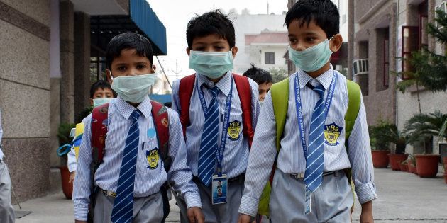School students have started wearing face masks to school after pollution levels increased after Diwali on 4 Nov 2016 in Delhi.