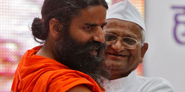 File photo of Indian yoga teacher Swami Ramdev (L) with veteran social activist Anna Hazare.