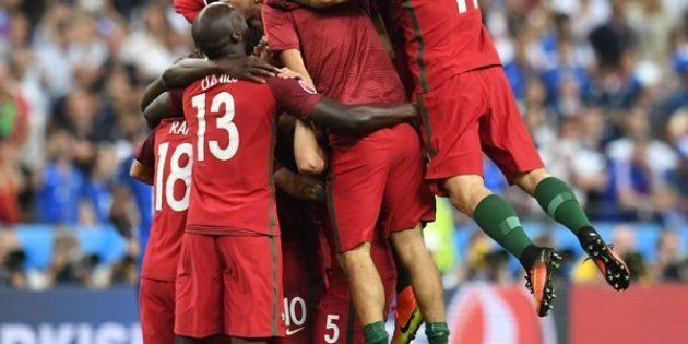 Portugal players celebrate after they scored a goal during the Euro 2016 final football match between Portugal and France at the Stade de France in Saint-Denis, north of Paris, on July 10, 2016. (FRANCISCO LEONG/AFP/Getty Images)