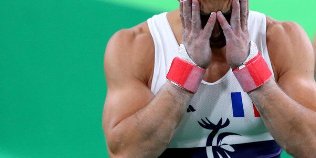 France's Danny Pinheiro Rodrigues reacts after teammate Samir Ait Said broke his leg while competing on the vault on Day 1 of the Rio 2016 Olympic Games.