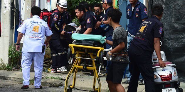 Thai rescue workers attend to an injured victim after a bomb exploded in Hua Hin, south of Bangkok