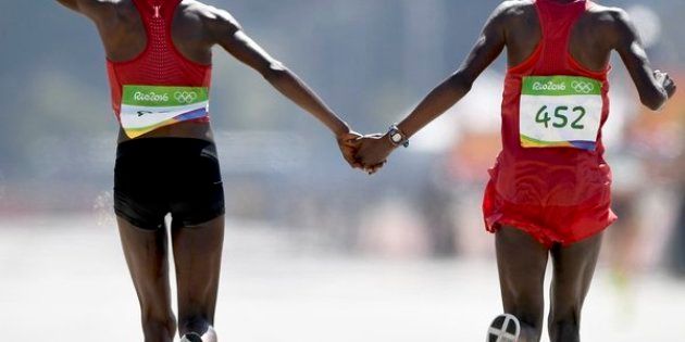 Kenya's Jemima Sumgong and Bahrain's Eunice Jepkirui Kirwa celebrate taking gold and silver in the women's marathon at Rio 2016 on Sunday.