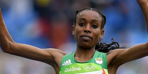 RIO DE JANEIRO, BRAZIL - AUGUST 12: Almaz Ayana of Ethiopia celebrates winning the Women's 10000 Meters Final on Day 7 of the Rio 2016 Olympic Games at the Olympic Stadium on August 12, 2016 in Rio de Janeiro, Brazil. (Photo by Shaun Botterill/Getty Images)