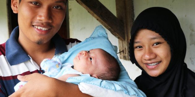 Anggit Bayu Saputro (left), age 21, and Wadianti, age 19, became parents five years before they'd planned. They feared using contraception and had little access to it as an unmarried couple.