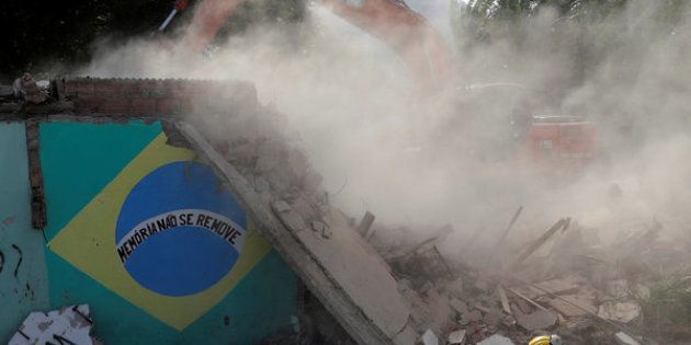 The house of Carlos Augusto and Sandra Regina (not pictured) who have lived in Vila Autodromo slum for 20 years with their children, is demolished after the family moved to one of the twenty houses built for the residents who refused to leave the community, in Rio de Janeiro, Brazil, August 2, 2016. Picture taken August 2, 2016. REUTERS/Ricardo Moraes SEARCH