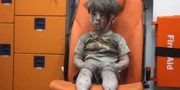 Omran Daqneesh, 5, was pictured in the back of an ambulance after being pulled from rubble, with an expression of incomprehension on his dust- and blood-caked face.