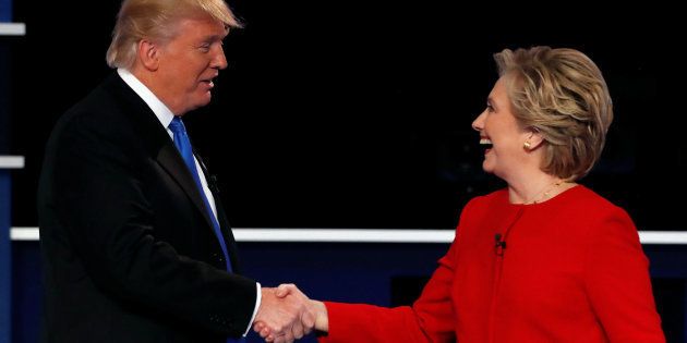 Republican U.S. presidential nominee Donald Trump and Democratic U.S. presidential nominee Hillary Clinton shake hands.